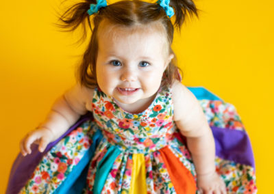 Happy child in beautiful dress smiling and looking up